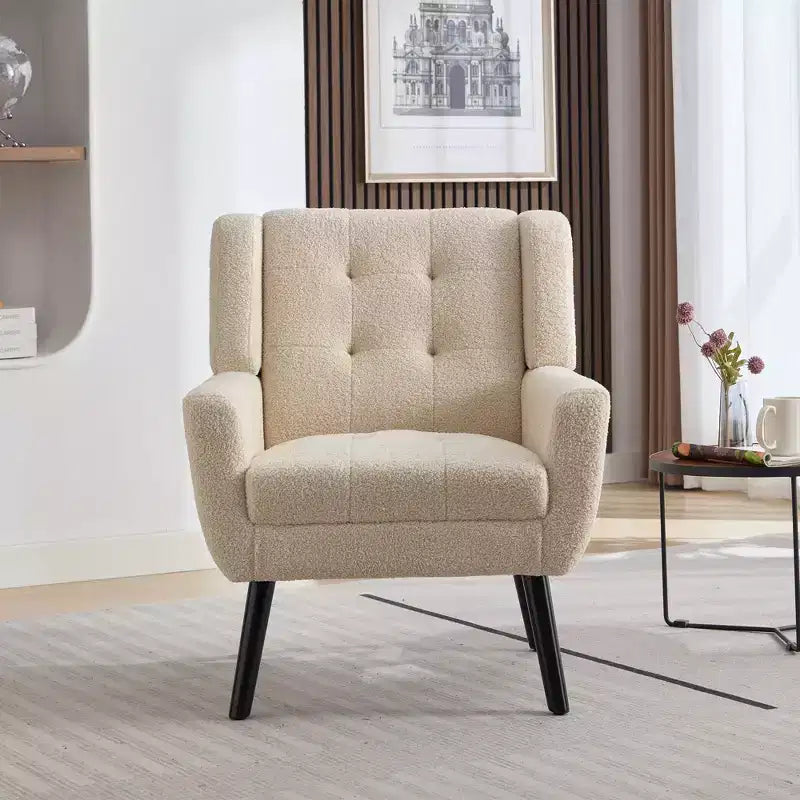 Poltrona moderna con bottoni Okak, poltrona da soggiorno imbottita con braccioli e gambe in legno nero, ergonomica per camera da letto