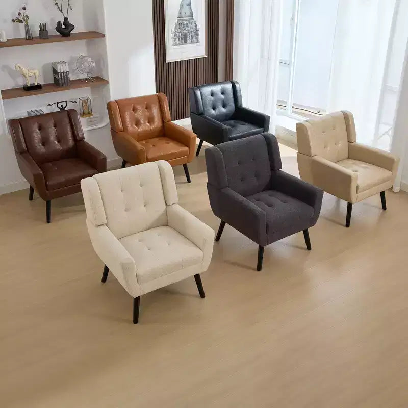 Poltrona moderna con bottoni Okak, poltrona da soggiorno imbottita con braccioli e gambe in legno nero, ergonomica per camera da letto