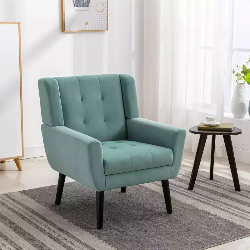 Poltrona moderna con bottoni Okak, poltrona da soggiorno imbottita con braccioli e gambe in legno nero, ergonomica per camera da letto