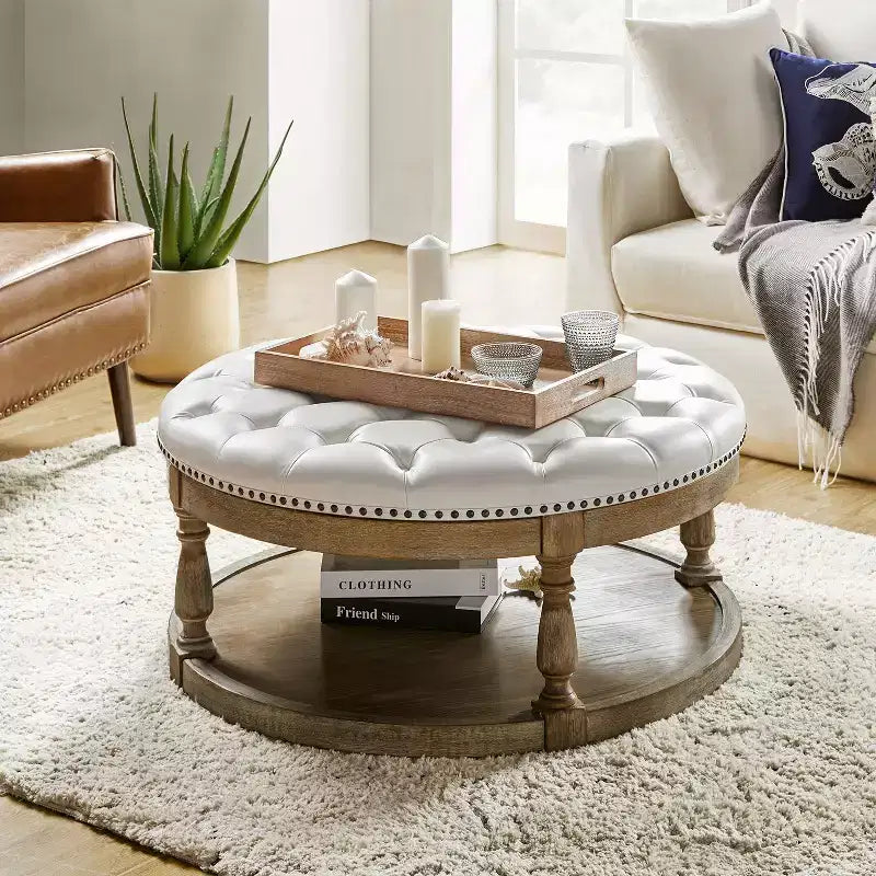 Pouf rotondo Chloe in pelle vegana con contenitore e borchie | ART OF LIVING DESIGNS